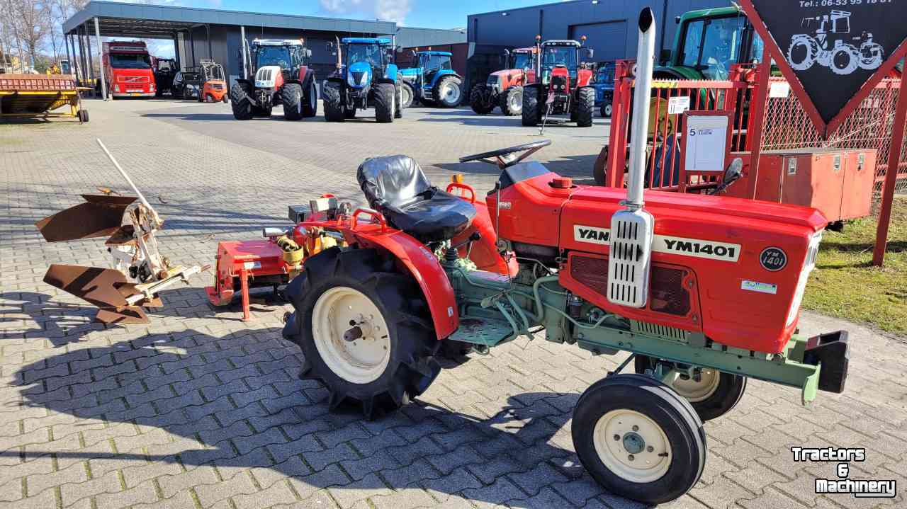 Horticultural Tractors Yanmar YM1401 met ploeg en frees.