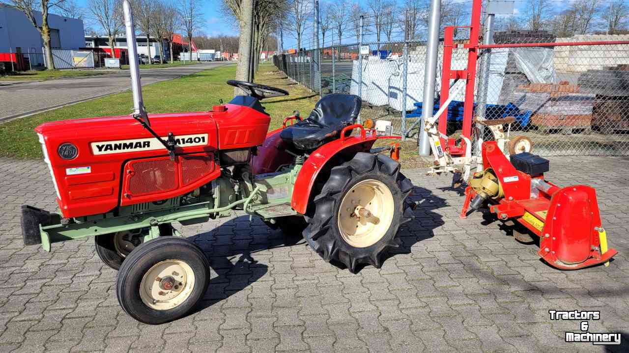 Horticultural Tractors Yanmar YM1401 met ploeg en frees.